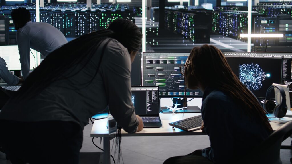 Cybersecurity team working on a firewall