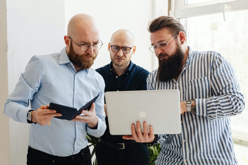 Business leaders reviewing IT governance strategy and technology decisions together