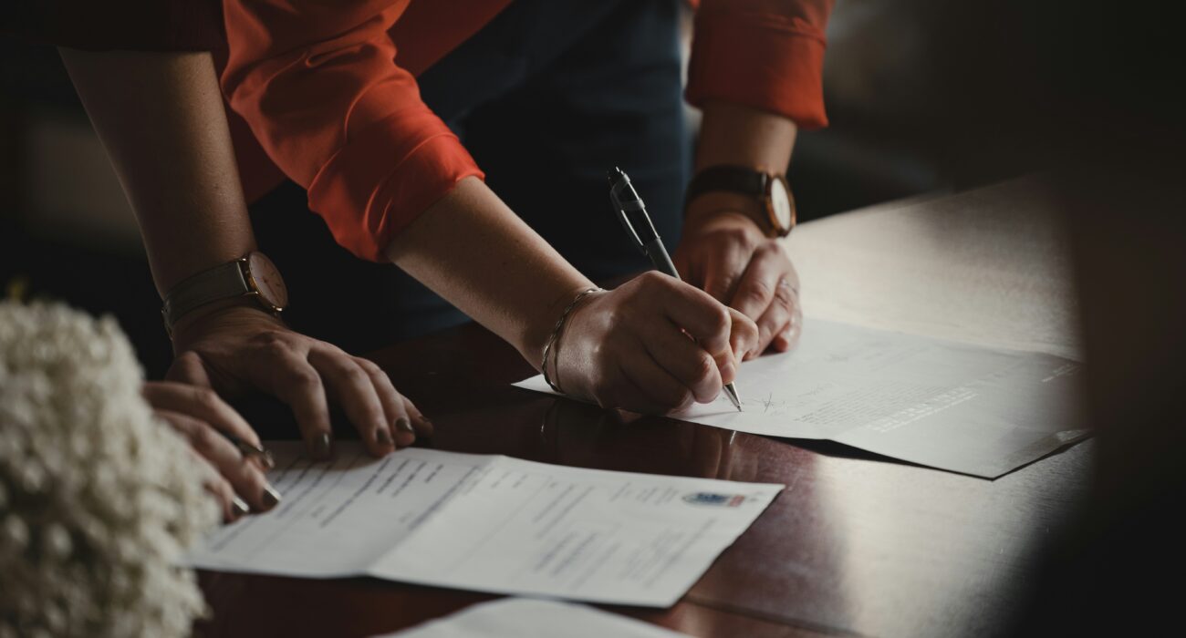 Business leaders reviewing a managed IT contract checklist with an IT services provider