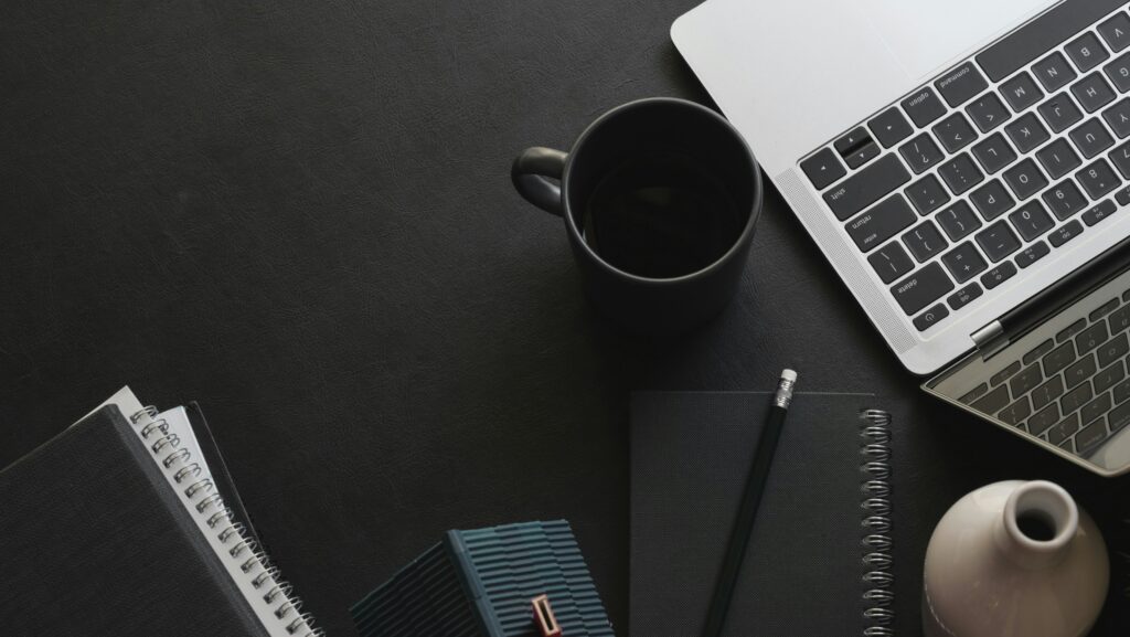 Email retention policy documentation and records management concept on a desk workspace