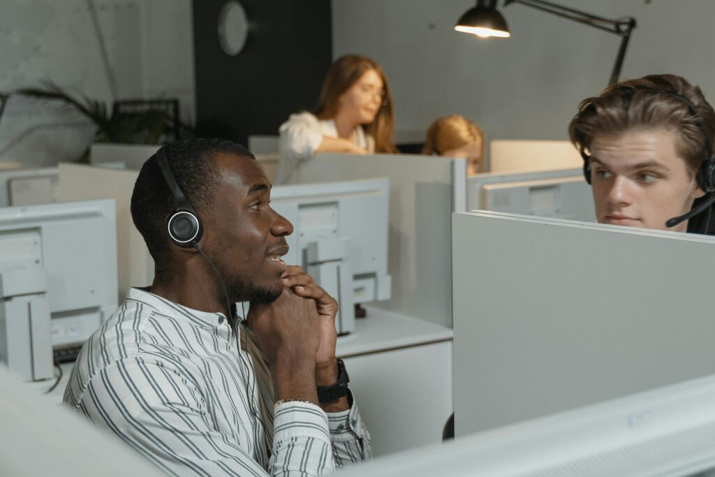 Managed help desk services team handling customer IT support calls in an office environment