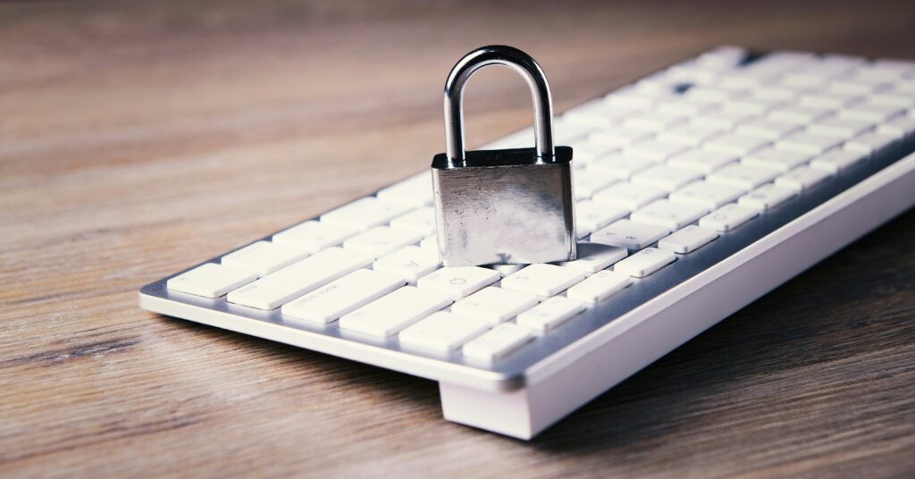 Cisco Umbrella SSO Setup concept image of a padlock on a keyboard representing secure admin sign-in.