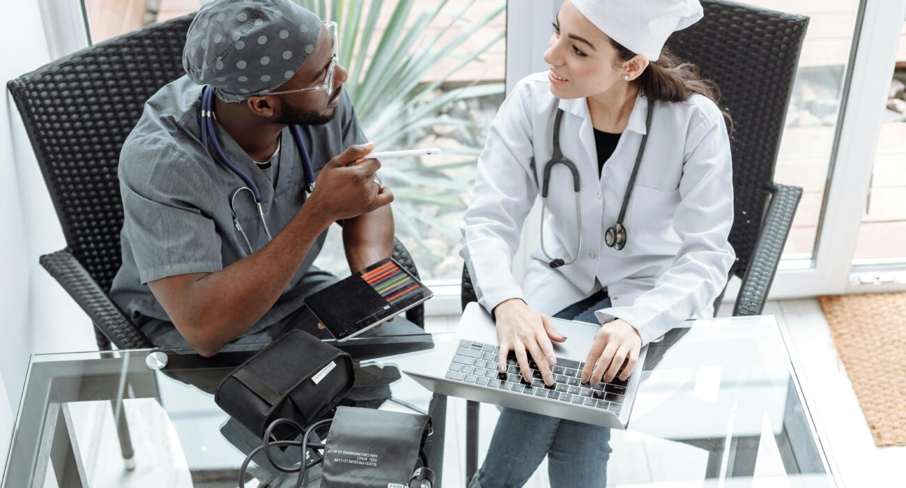 Medical professionals reviewing patient and device information during a HIPAA compliance checklist discussion