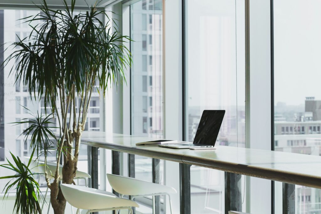 IT Asset Management workspace showing structured tracking of business technology assets in a clean office setting
