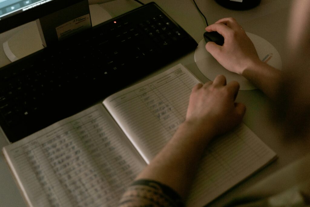 Staff member reviewing records and computer activity as part of a HIPAA compliance checklist process