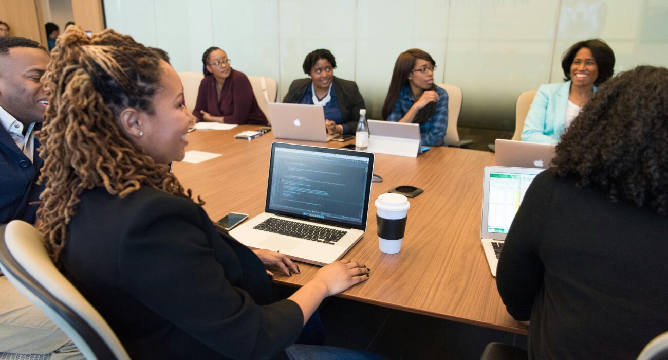 Team meeting with laptops representing top IT support companies in Studio City, CA helping businesses plan technology support.