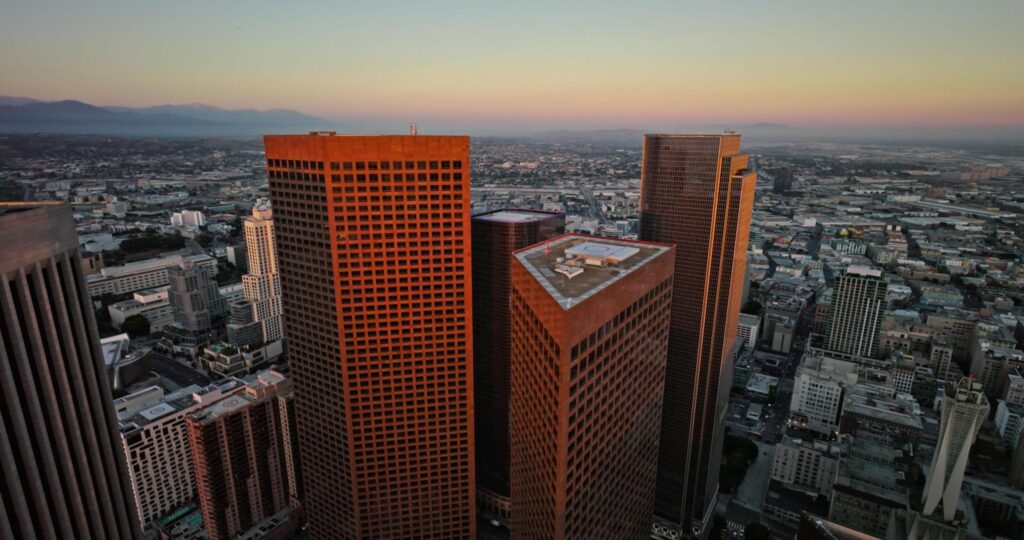 Los Angeles office towers at sunset for businesses reviewing managed IT services cost in Los Angeles.