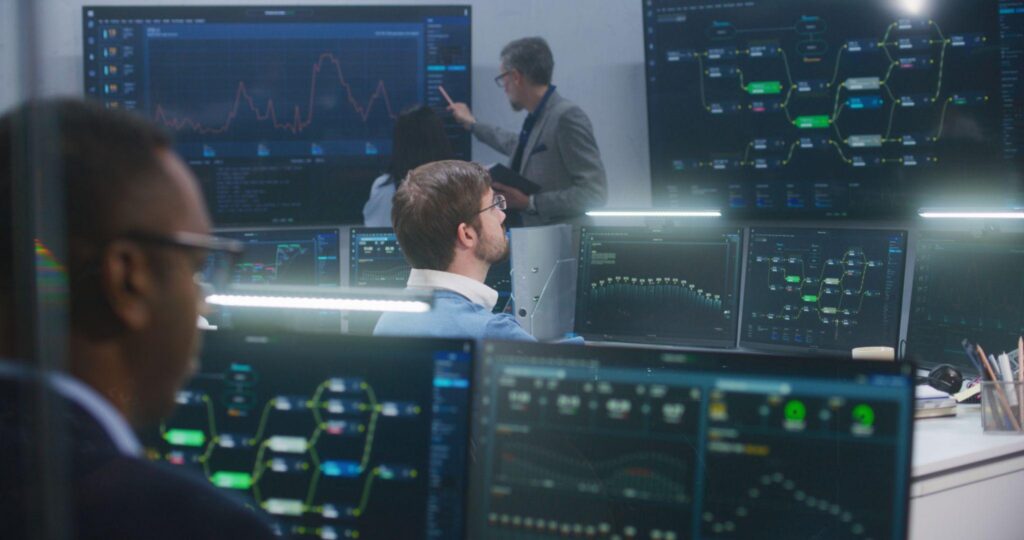 IT support specialists monitoring business systems for managed IT services cost Los Angeles planning.