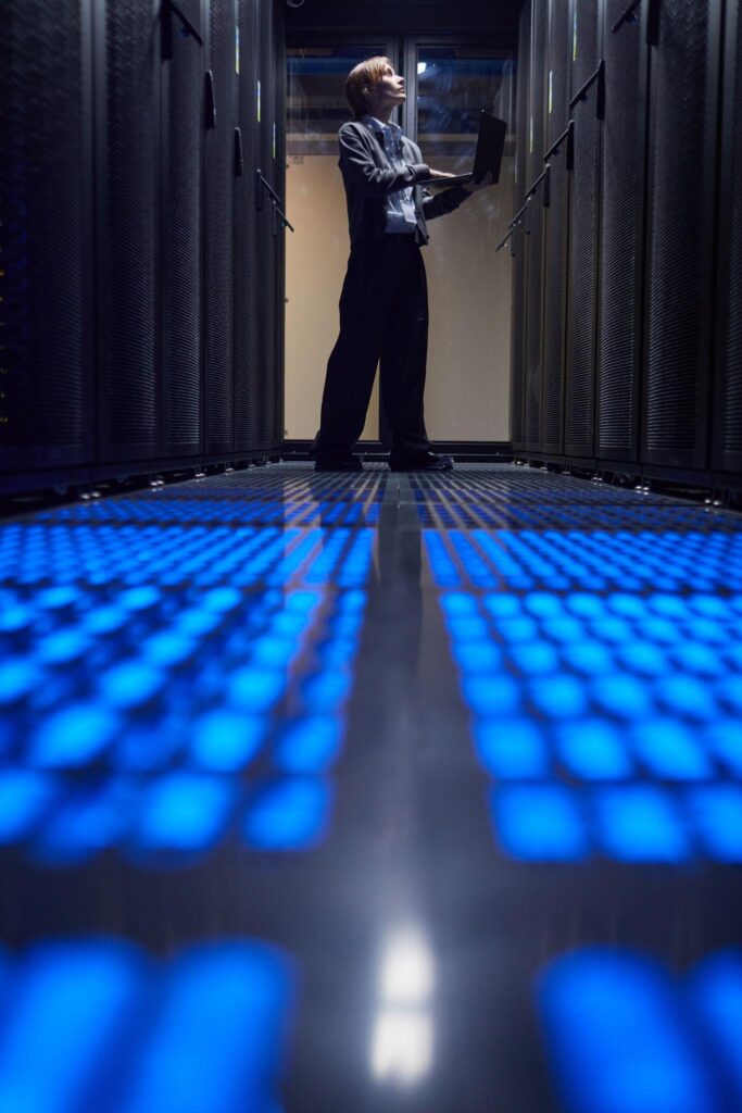 IT professional working in a server room supporting managed IT services for Beverly Hills businesses