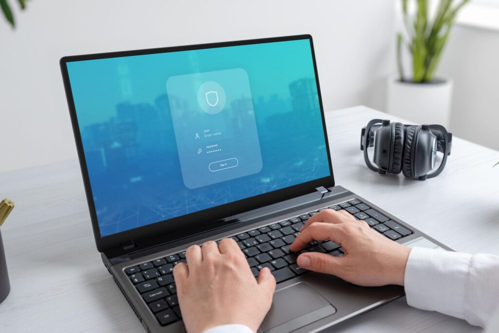 Employee using a secure login screen for identity access management services in Los Angeles.