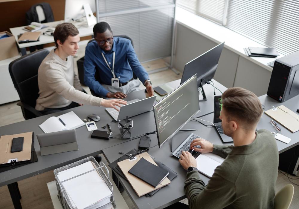 IT support specialists troubleshooting business technology for a small company