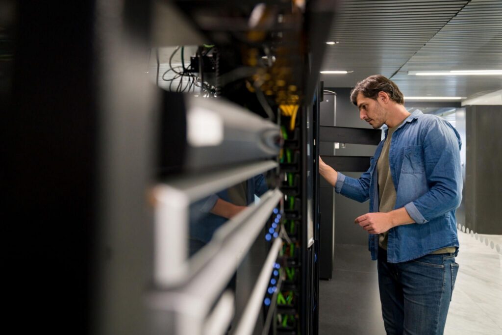 IT technician checking server equipment for reliable IT support in Burbank business environments