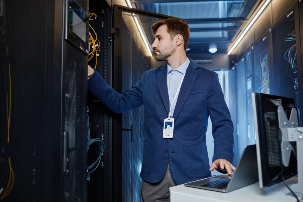 IT technician managing server equipment for businesses using managed IT services in Long Beach