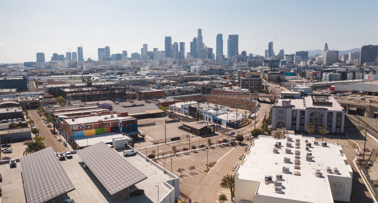 Los Angeles industrial district and manufacturing facilities with the Downtown LA skyline in the background.